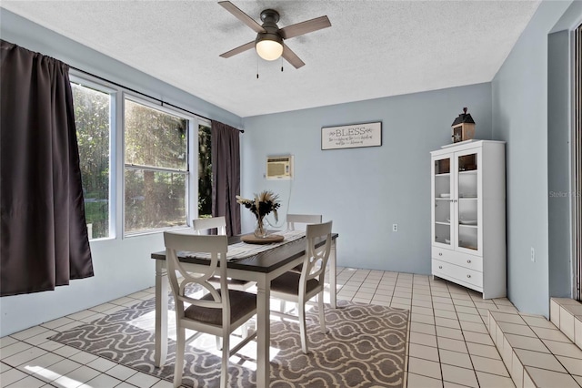 3058 SE 3rd Ave, Ocala, FL 34471 - dining room featuring light tile patterned floors, a textured ceiling, a wall mounted air conditioner, and a ceiling fan