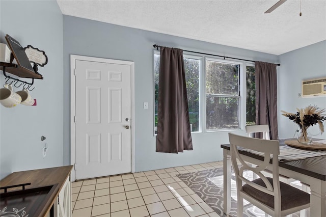 3058 SE 3rd Ave, Ocala, FL 34471 - dining room featuring light tile patterned floors, a textured ceiling, a wall mounted air conditioner, and a ceiling fan