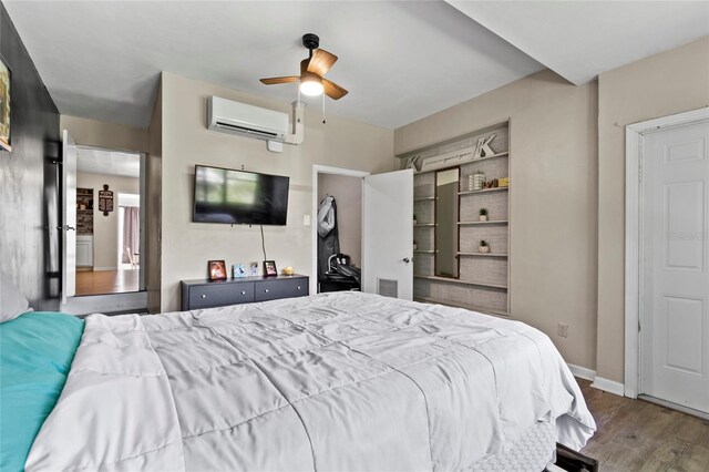3058 SE 3rd Ave, Ocala, FL 34471 - bedroom featuring visible vents, baseboards, wood finished floors, a wall mounted AC, and a ceiling fan