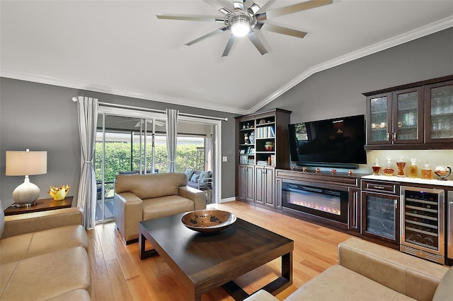 living area featuring wine cooler, light wood finished floors, and ornamental molding