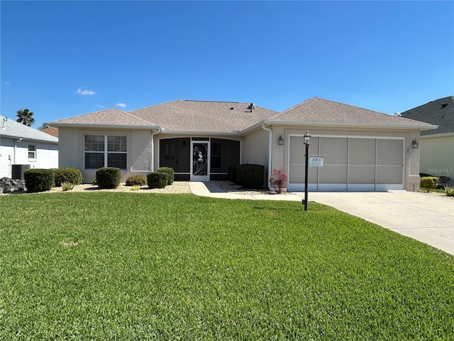 ranch-style house with stucco siding, a garage, concrete driveway, and a front lawn