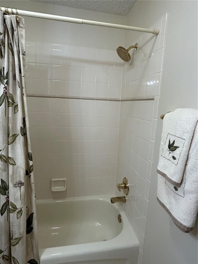 bathroom with shower / tub combo with curtain