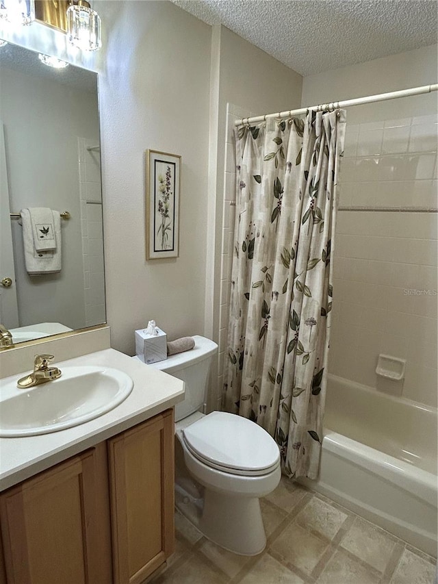 full bath featuring toilet, shower / bath combo, vanity, and a textured ceiling