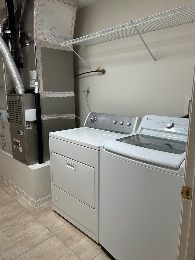 clothes washing area with laundry area and independent washer and dryer