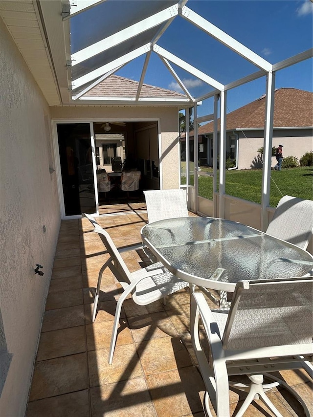 sunroom featuring vaulted ceiling