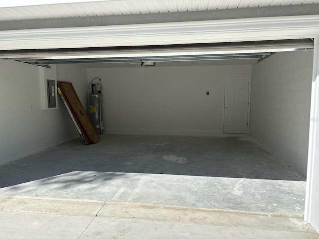 garage with electric panel, a garage door opener, and water heater