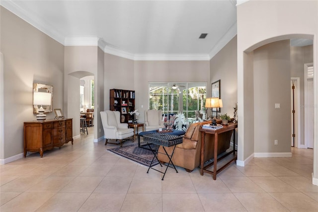 living room with visible vents, arched walkways, and baseboards