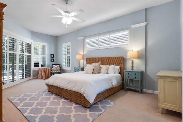 bedroom featuring access to exterior, baseboards, carpet floors, and ceiling fan