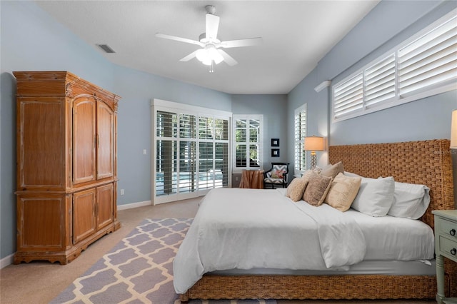 bedroom featuring a ceiling fan, visible vents, baseboards, access to outside, and light colored carpet