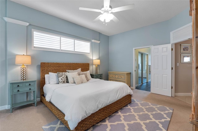 bedroom featuring carpet, baseboards, and ceiling fan