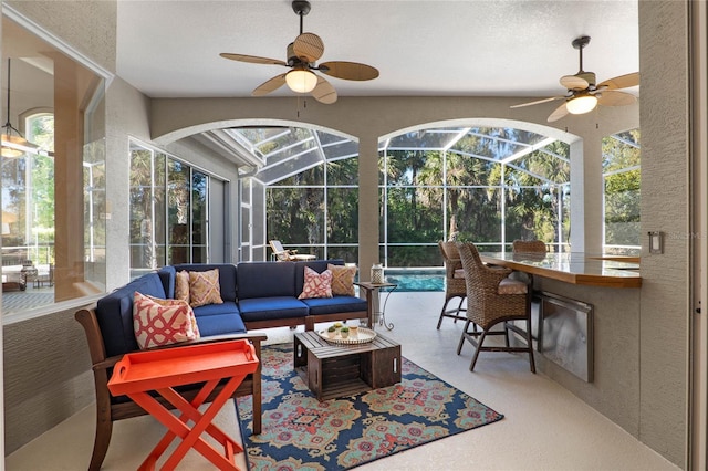 sunroom with ceiling fan