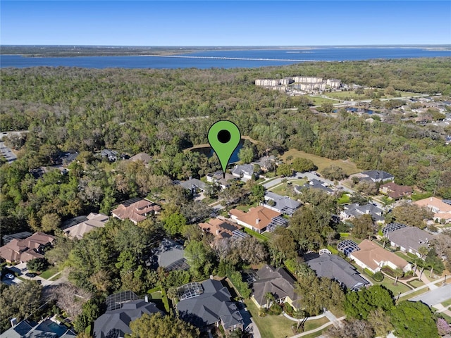 aerial view with a residential view and a view of trees