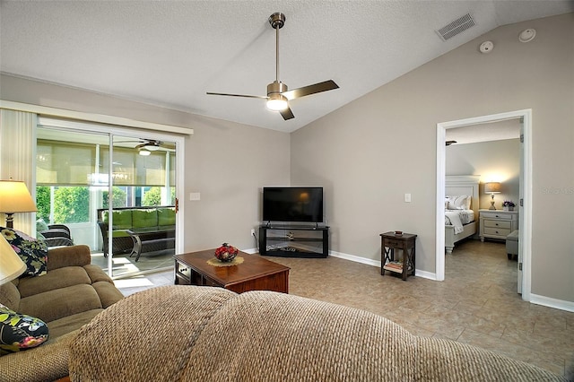 living area featuring visible vents, a ceiling fan, a textured ceiling, baseboards, and vaulted ceiling