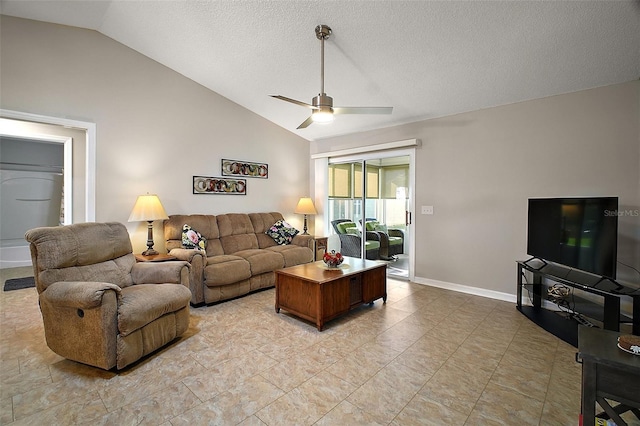 living room featuring baseboards, a textured ceiling, a ceiling fan, and lofted ceiling