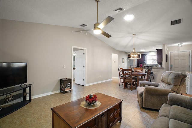 living area with visible vents, a ceiling fan, and vaulted ceiling