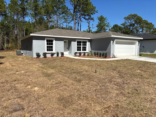 ranch-style home with stucco siding, driveway, a front lawn, and an attached garage