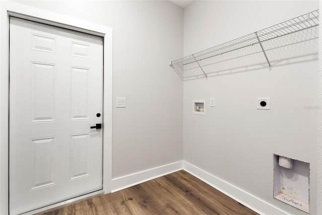 clothes washing area featuring dark wood-type flooring, washer hookup, baseboards, hookup for an electric dryer, and laundry area