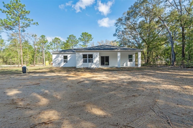 back of house with stucco siding