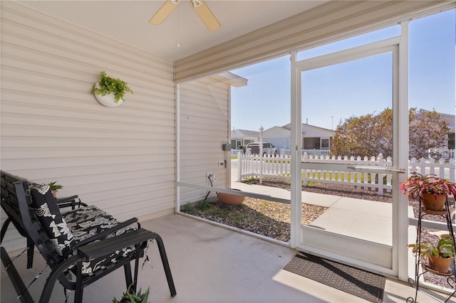 sunroom / solarium with ceiling fan