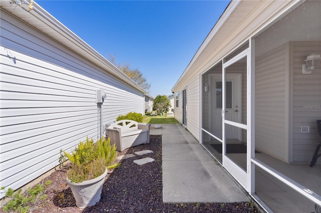 exterior space featuring a sunroom