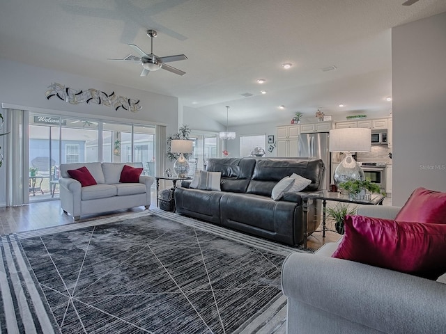 living room with recessed lighting, lofted ceiling, and ceiling fan