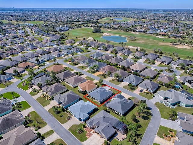 bird's eye view featuring view of golf course, a residential view, and a water view