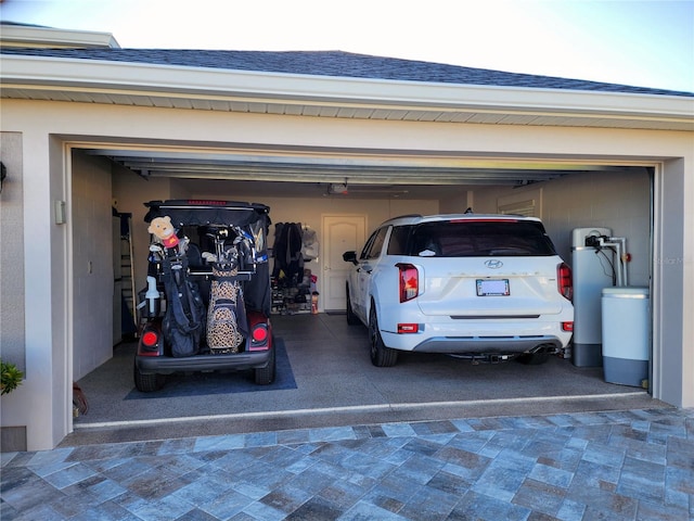 garage featuring decorative driveway and a garage door opener