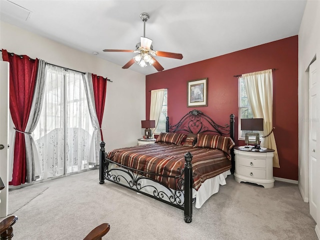 carpeted bedroom featuring a ceiling fan