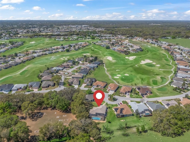 birds eye view of property featuring golf course view and a residential view