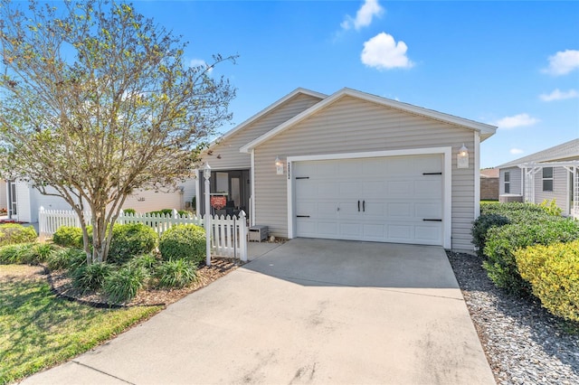 ranch-style house with fence, a garage, and driveway