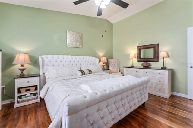 bedroom with baseboards, lofted ceiling, wood finished floors, and a ceiling fan