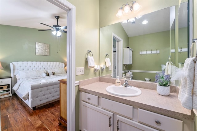 bathroom featuring vanity, wood finished floors, and a ceiling fan