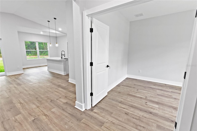 12444 SW 76th Ln, Dunnellon, FL 34432 - spare room with light wood finished floors, lofted ceiling, and recessed lighting