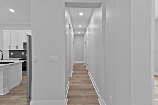 12444 SW 76th Ln, Dunnellon, FL 34432 - hallway with recessed lighting and light wood-type flooring