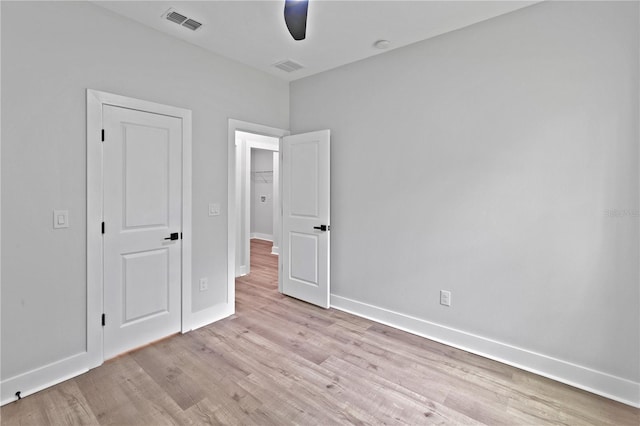 12444 SW 76th Ln, Dunnellon, FL 34432 - unfurnished bedroom featuring light wood-type flooring and ceiling fan