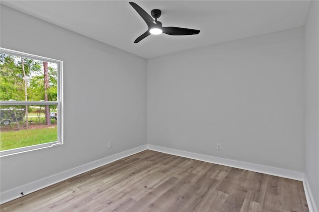 12444 SW 76th Ln, Dunnellon, FL 34432 - empty room featuring wood finished floors and a ceiling fan