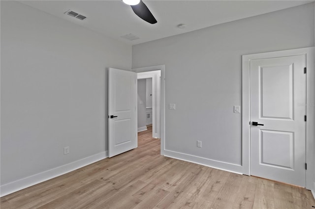 12444 SW 76th Ln, Dunnellon, FL 34432 - unfurnished bedroom with light wood-style floors and ceiling fan