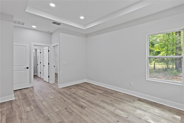 12444 SW 76th Ln, Dunnellon, FL 34432 - unfurnished room with light wood-type flooring, recessed lighting, and a raised ceiling
