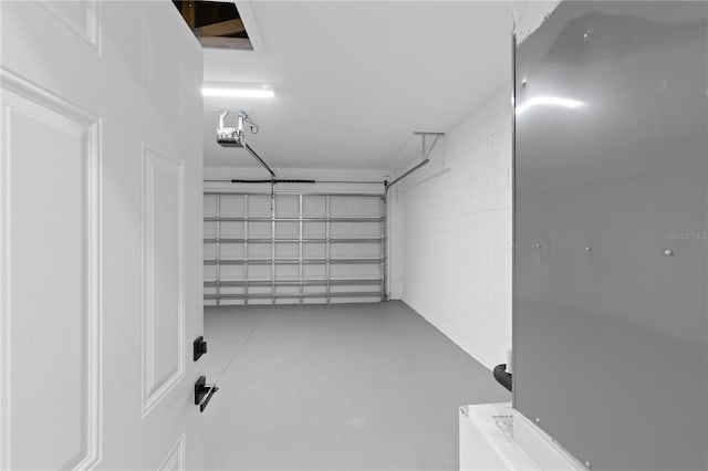 12444 SW 76th Ln, Dunnellon, FL 34432 - garage with a garage door opener and concrete block wall