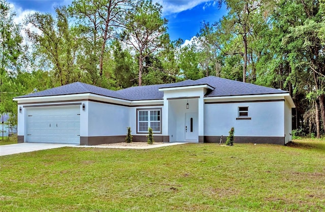 12444 SW 76th Ln, Dunnellon, FL 34432 - view of front of home with a garage, driveway, a front yard, and stucco siding