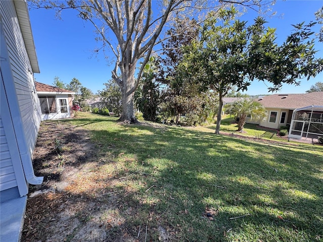 view of yard with a sunroom