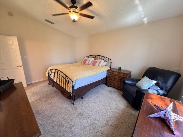 carpeted bedroom with visible vents, baseboards, ceiling fan, lofted ceiling, and a textured ceiling