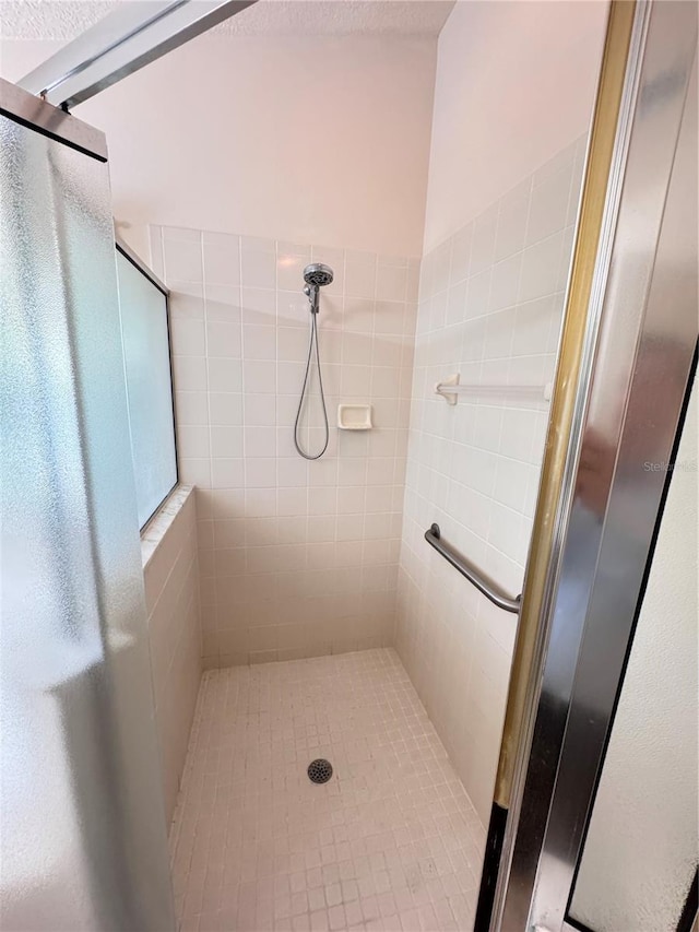 full bath featuring a stall shower