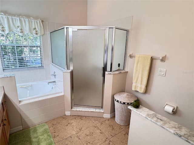 full bath with vanity, a shower stall, a garden tub, and tile patterned flooring