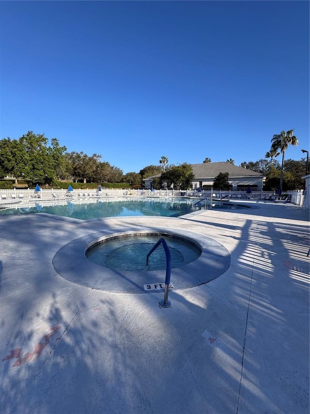 community pool with fence