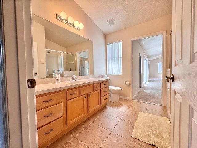 24614 Stillridge Ct, Leesburg, FL 34748 - full bath featuring a textured ceiling, toilet, a shower stall, visible vents, and lofted ceiling