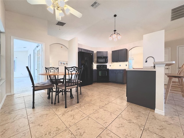 24614 Stillridge Ct, Leesburg, FL 34748 - kitchen featuring visible vents, light countertops, and black appliances