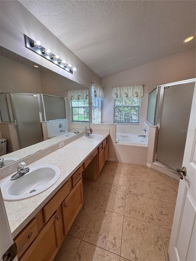 24614 Stillridge Ct, Leesburg, FL 34748 - bathroom featuring a sink, tile patterned floors, a bath, and vaulted ceiling