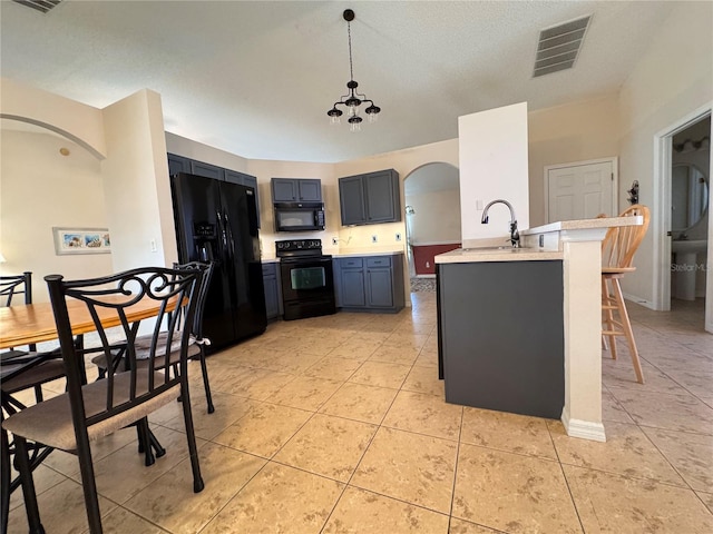 24614 Stillridge Ct, Leesburg, FL 34748 - kitchen featuring visible vents, light countertops, black appliances, and arched walkways
