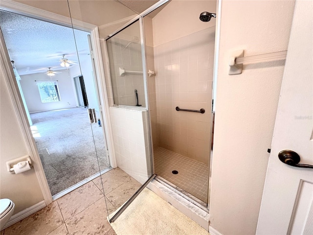 24614 Stillridge Ct, Leesburg, FL 34748 - full bathroom with toilet, tile patterned floors, a ceiling fan, and a stall shower
